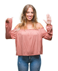 Sticker - Beautiful young blonde woman over isolated background showing and pointing up with fingers number six while smiling confident and happy.