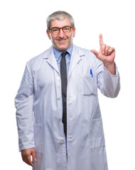 Wall Mural - Handsome senior doctor, scientist professional man wearing white coat over isolated background pointing finger up with successful idea. Exited and happy. Number one.