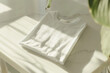 White shirt resting on white table