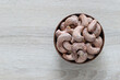 Roasted cashew nuts in a bowl on wooder background, Healthy eating concept