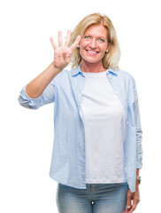 Sticker - Middle age blonde woman over isolated background showing and pointing up with fingers number four while smiling confident and happy.