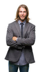 Canvas Print - Young handsome business man with long hair over isolated background happy face smiling with crossed arms looking at the camera. Positive person.