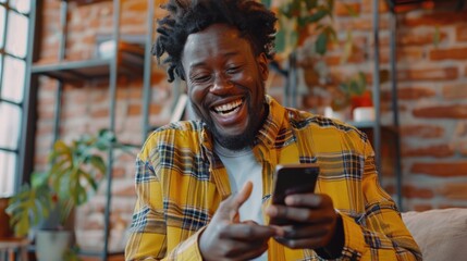 Poster - A man smiling while looking at his cell phone. Suitable for technology concepts