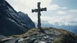 © vefimov - A large cross is standing on a rocky mountain top. The scene is serene and peaceful, with the mountain range in the background and the cross as the focal point