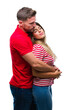 © Krakenimages.com - Young couple in love over isolated background looking to side, relax profile pose with natural face with confident smile.
