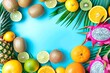 Summer background with copy space, tropical, exotic juicy fruits - kiwi, lemon, orange, dragon fruit, pineapple, on a light blue background with palm leaf