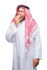 Canvas Print - Young handsome man wearing keffiyeh over isolated background bored yawning tired covering mouth with hand. Restless and sleepiness.