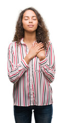 Sticker - Beautiful young hispanic woman smiling with hands on chest with closed eyes and grateful gesture on face. Health concept.