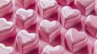 A close up of pink heart shaped candy.