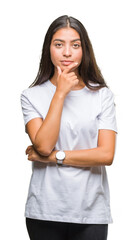 Wall Mural - Young beautiful arab woman over isolated background looking confident at the camera with smile with crossed arms and hand raised on chin. Thinking positive.