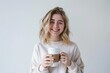 © shelbys - A woman in a white sweater is holding a cup of coffee and smiling brightly. Fictional Character Created By Generative AI.