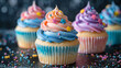 Colorful cupcakes decorated with stars and sprinkles on a glittery backdrop create a whimsical party feel