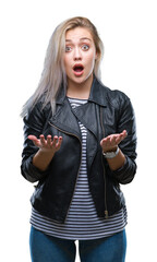 Wall Mural - Young blonde woman wearing fashion jacket over isolated background afraid and shocked with surprise expression, fear and excited face.