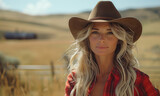 Fototapeta  - Portrait of blonde cowgirl on the farm