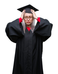 Sticker - Young blonde woman wearing graduate uniform over isolated background suffering from headache desperate and stressed because pain and migraine. Hands on head.