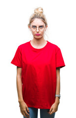 Wall Mural - Young beautiful blonde woman wearing red t-shirt and glasses over isolated background depressed and worry for distress, crying angry and afraid. Sad expression.