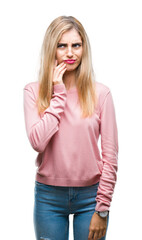 Sticker - Young beautiful blonde woman wearing pink winter sweater over isolated background touching mouth with hand with painful expression because of toothache or dental illness on teeth. Dentist concept.