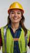 Portrait of a happy smiling construction worker wearing hard hat and vest on a clean white background
