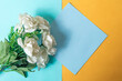 Bouquet of white roses with sticky notes on blue and yellow background for wedding, mother's day, valentine's day, anniversary, birthday etc. Top view