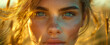 Close-up of a woman's freckled face with vibrant blue eyes in golden light