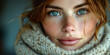 Beautiful young woman with blue eyes and freckles wearing scarf