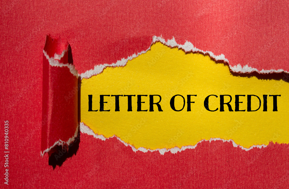 Letter of credit words written on ripped red paper with yellow ...