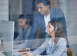 © peopleimages.com - Call center, supervisor and training with telemarketing people in office for customer service or support. Computer, contact us and window with agent team in workplace for communication or solution
