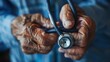 Close up of a stethoscope in the hands of an elderly woman