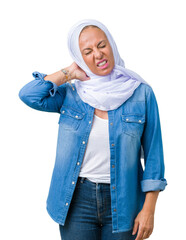 Sticker - Middle age eastern arab woman wearing arabian hijab over isolated background Suffering of neck ache injury, touching neck with hand, muscular pain