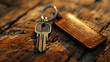Close-up of a leather keychain with keys on a wooden background.