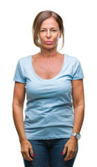 Poster - Middle age senior hispanic woman over isolated background with serious expression on face. Simple and natural looking at the camera.