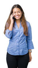 Canvas Print - Young beautiful brunette business woman talking on smartphone over isolated background with a happy face standing and smiling with a confident smile showing teeth