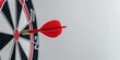 Perfect Bullseye: Close-up of Red Dart in Center of Dartboard. The concept of hitting the target and success. Banner with copy space for text