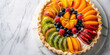 Top view of a classic French fruit tart, adorned with a colorful array of seasonal fruits and glazed with apricot jam, on a white marble platter
