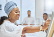 © peopleimages.com - Presentation, business and happy woman writing on board for training, planning or brainstorming ideas in startup office. Team speaker, leader and strategy for creative designer coaching staff group