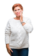 Sticker - Atrractive senior caucasian redhead woman wearing winter sweater over isolated background touching mouth with hand with painful expression because of toothache or dental illness on teeth.