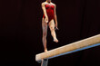 woman exercise on balance beam gymnastics in black background