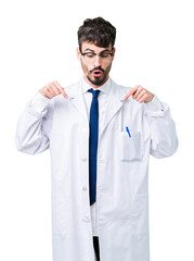 Wall Mural - Young professional scientist man wearing white coat over isolated background Pointing down with fingers showing advertisement, surprised face and open mouth