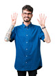 © Krakenimages.com - Young handsome man wearing glasses over isolated background showing and pointing up with fingers number nine while smiling confident and happy.