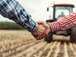 © aka_artiom - A farmer and a businessman shake hands beside a tractor in the background.
