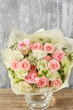 Small Beautiful bouquet of mixed flowers in vase. Floral shop concept . Beautiful fresh cut bouquet. Flowers delivery
