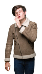 Wall Mural - Young handsome man wearing winter coat over isolated background hand on mouth telling secret rumor, whispering malicious talk conversation