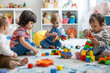 Children playing with colorful educative toys in nursery school, kindergarten or childcare center