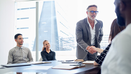 Aufkleber - Businessman, meeting and handshake with team for partnership, deal or agreement in conference. Man, CEO or executive shaking hands with employee for hiring, recruiting or b2b together at workplace