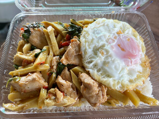 Sticker - close up of thai food, fried spicy bail and bamboo shoot with pork and egg on hot rice