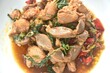 spicy chili stir-fried chicken meat and gizzard couple liver with basil leaf on plate