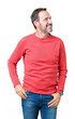 © Krakenimages.com - Handsome middle age hoary senior man wearing winter sweater over isolated background looking away to side with smile on face, natural expression. Laughing confident.