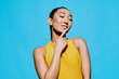 Trendy woman surprised blue portrait white fashion casual yellow studio lifestyle beauty person smile