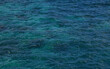 Abstract transparent turquoise blue ocean water background.Sea waves natural texture.Selective focus.

