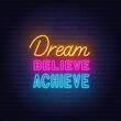 Dream Believe Achieve  neon lettering on brick wall background